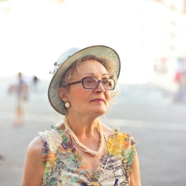 Elegant senior woman in Florence, Italy, enjoying a sunny day.